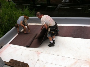 Placing the drain mat on top of the foam insulation