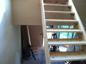 Getting the wall plywood in let us install the permanent stairs