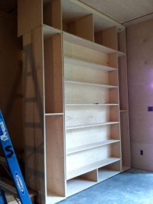 the sliding cabinet that covers the living room murphy bed